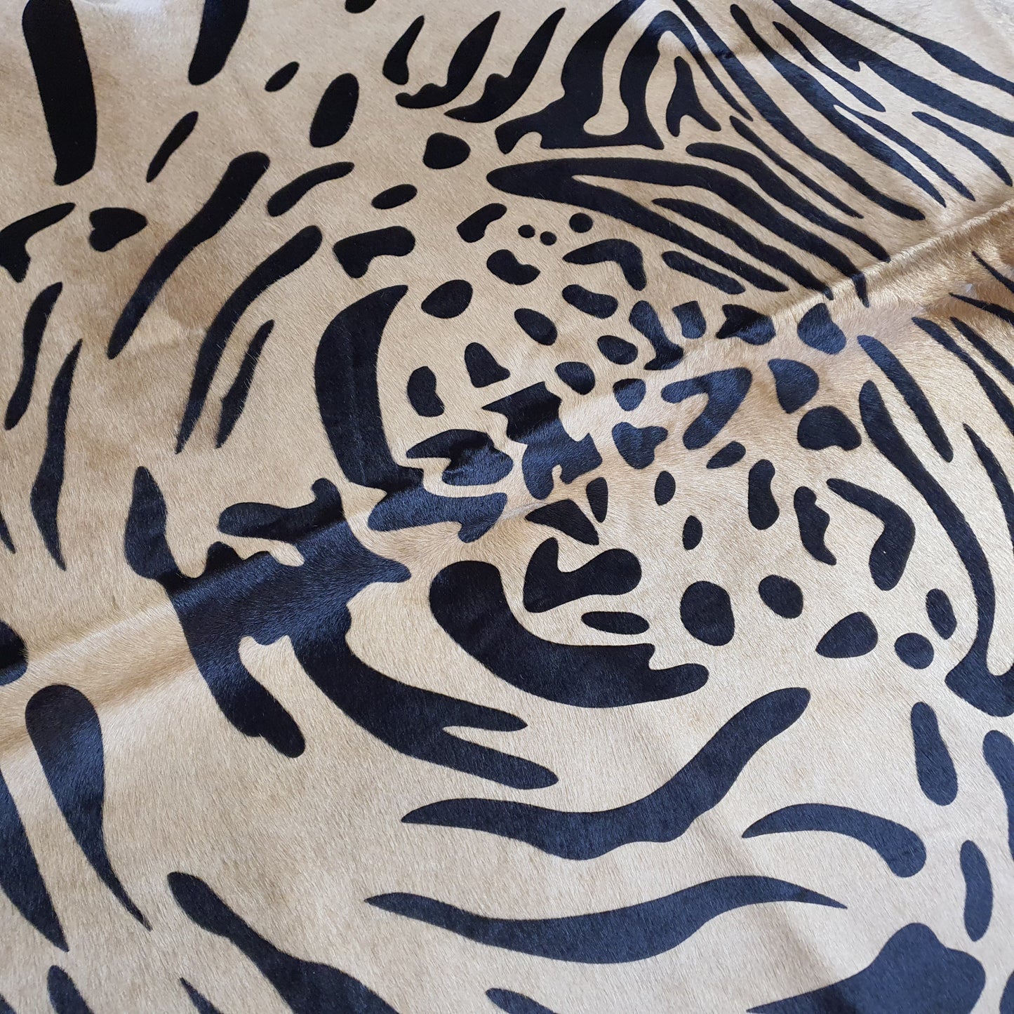Tiger Javali on Caramel Cowhide Rug