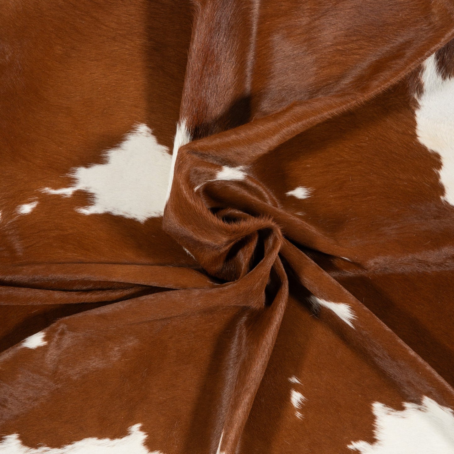 Brown and White Cowhide Rug