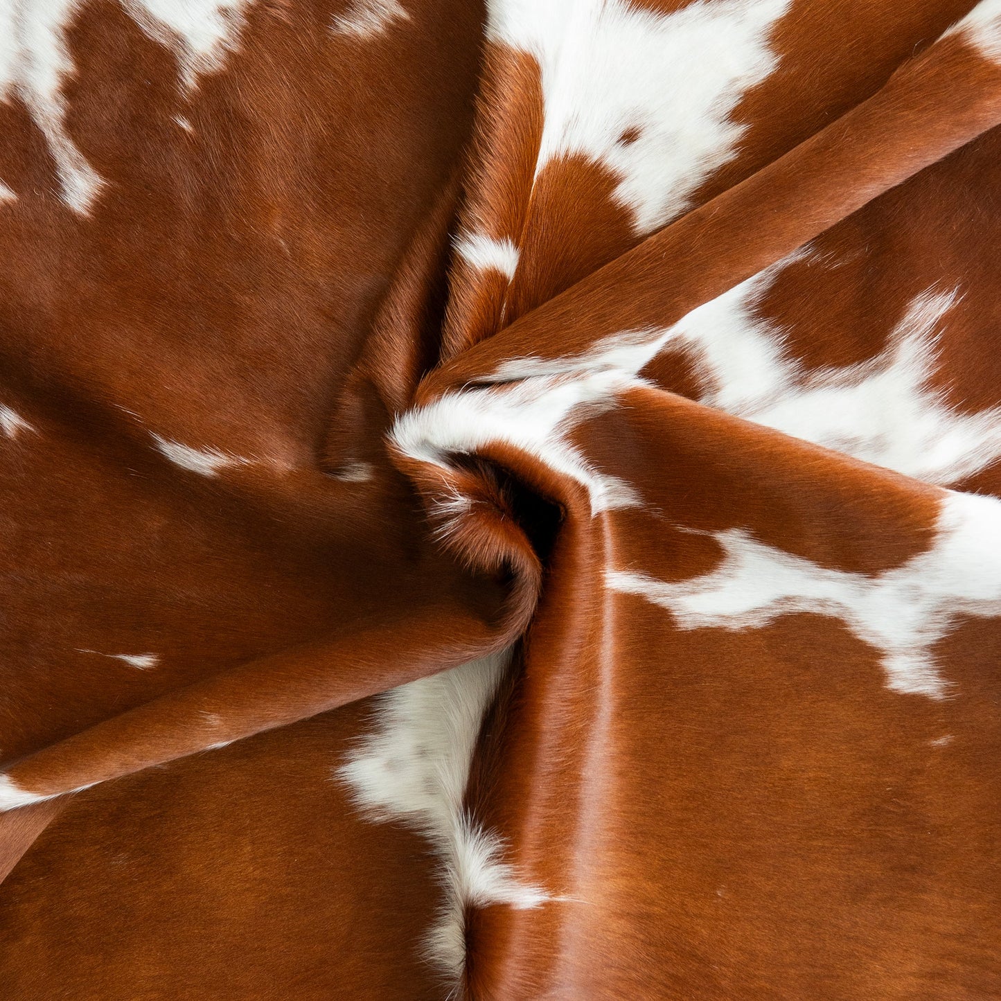 Brown and White Cowhide Rug
