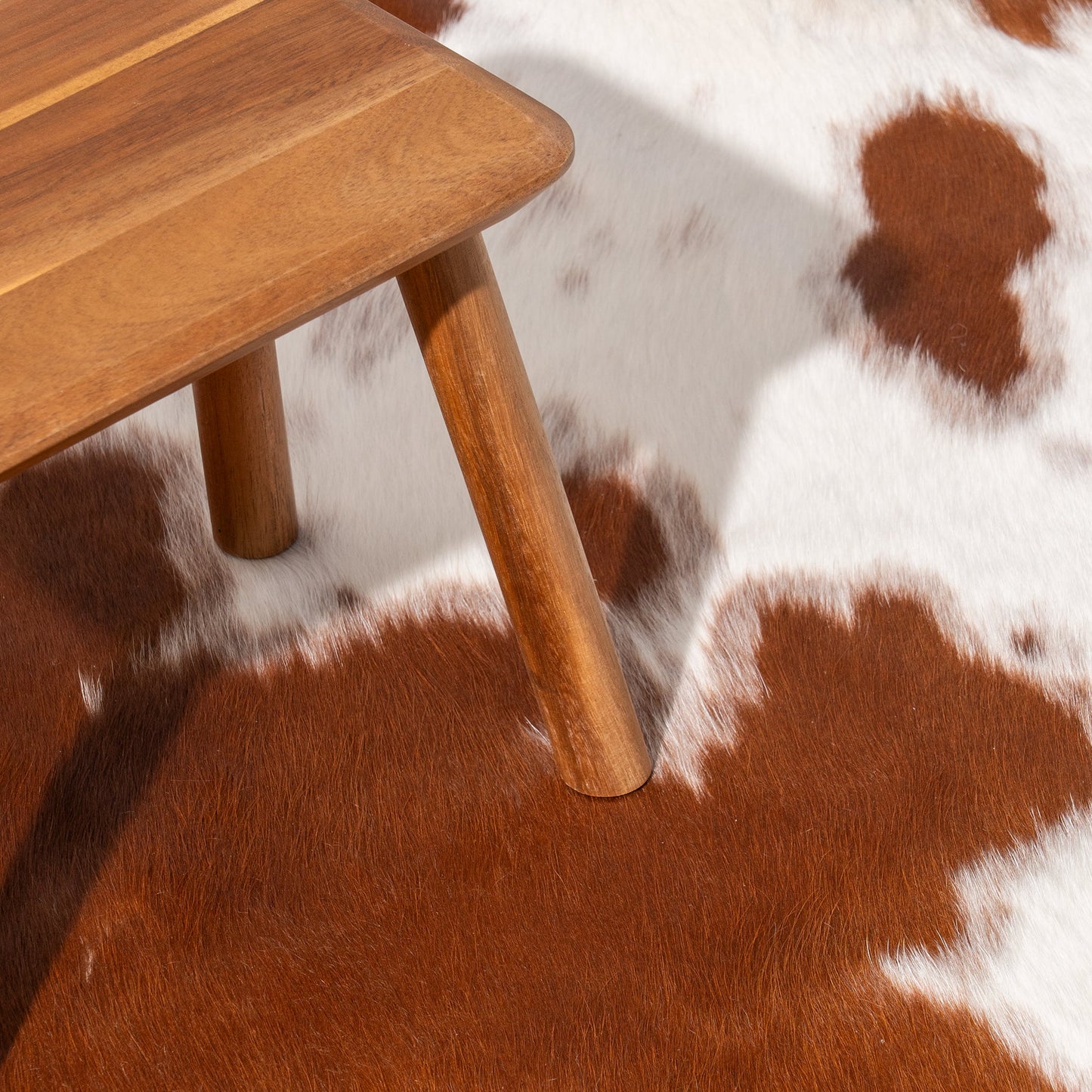 Brown and White Cowhide Rug