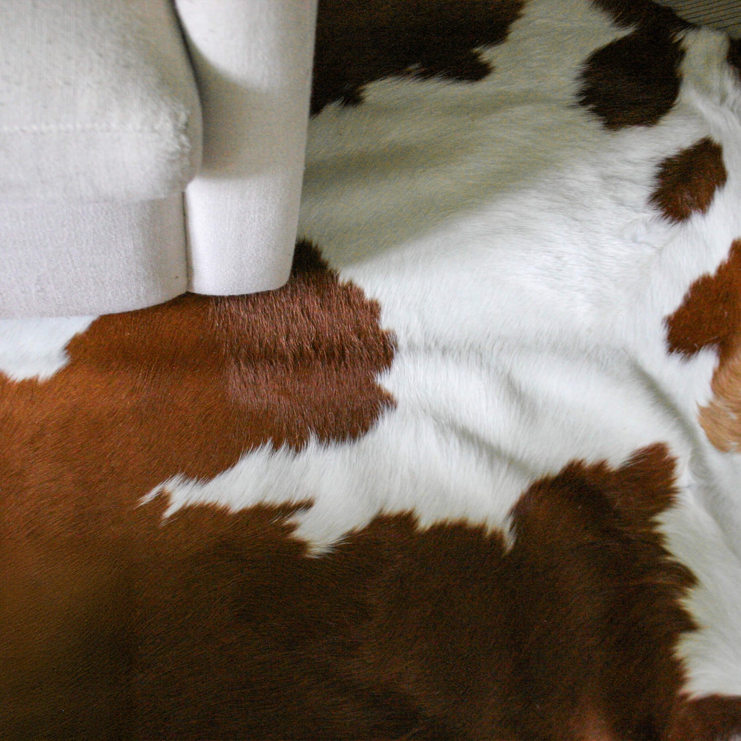 Brown and White Cowhide Rug